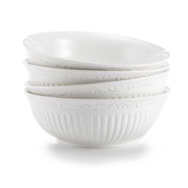   the fluted bands and column like detailing of this dinnerware recall